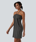 Garazi | Vestido mini de estilo resort con tirantes cruzados a la espalda y bolsillos