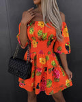 Mercè | Vestido de mujer elástico con hombros descubiertos, estampado floral de frutas tropicales, cintura fruncida y bajo con volantes, corte en A.