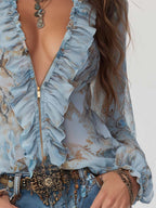 Marta | Blusa de gasa azul estampada con volantes