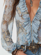 Marta | Blusa de gasa azul estampada con volantes
