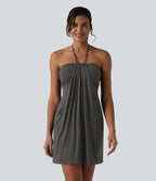Garazi | Vestido mini de estilo resort con tirantes cruzados a la espalda y bolsillos