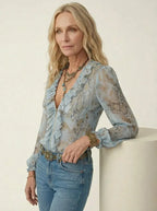 Blusa con estampado de serpiente y volantes