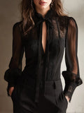Blusa negra con lazada al cuello