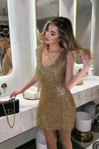 Vestido corto con lentejuelas y flecos