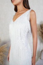 Vestido corto con lentejuelas y flecos